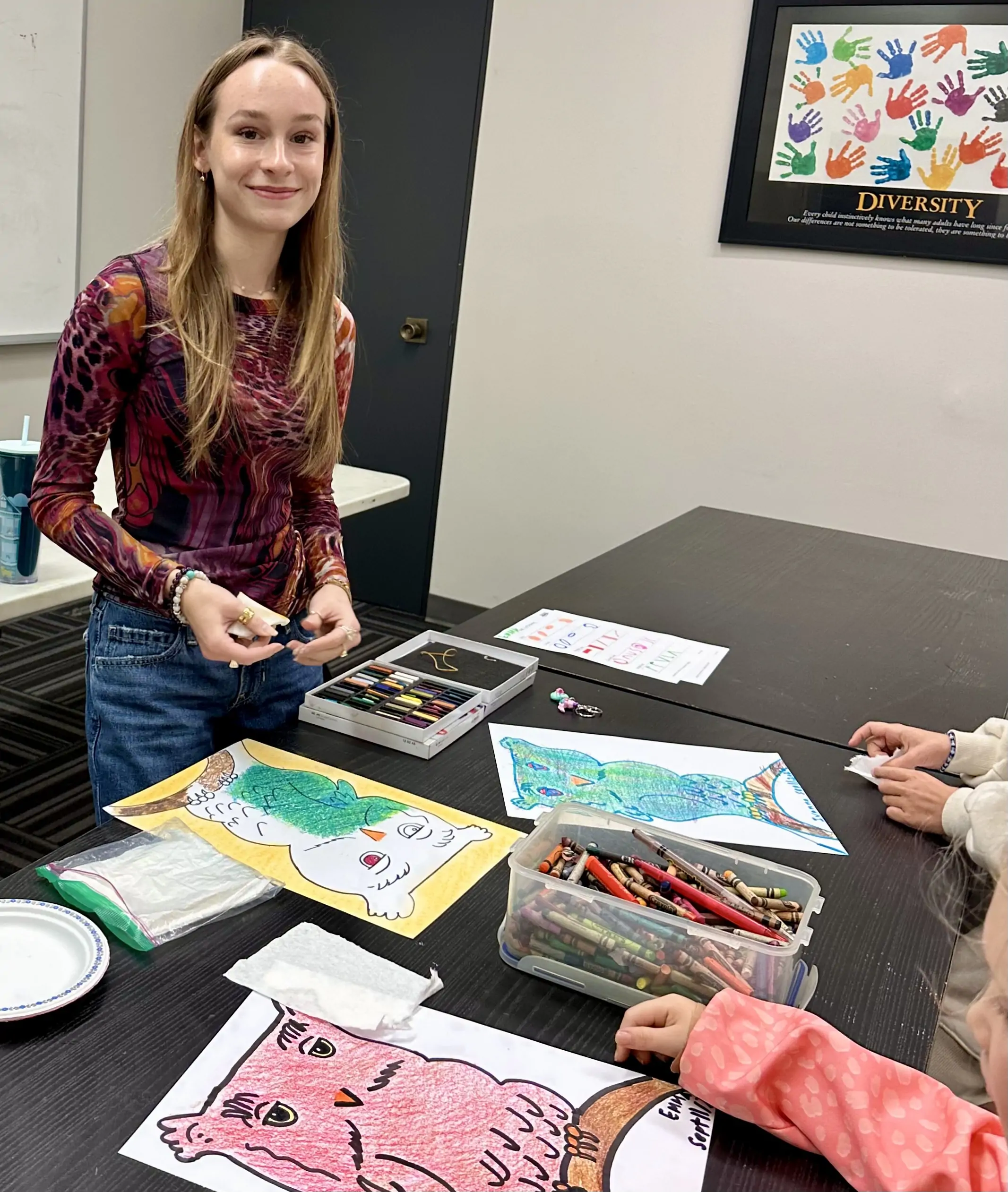 Karina guiding students during an art activity at Aliki’s Art House.