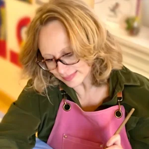Penny creating artwork during the Draw-a-Little & Paint-a-Little class.